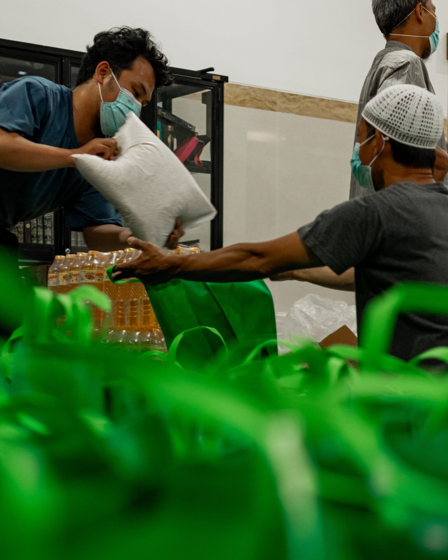 a group of people in a room with masks on
