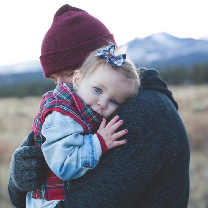 Man Carrying a Baby