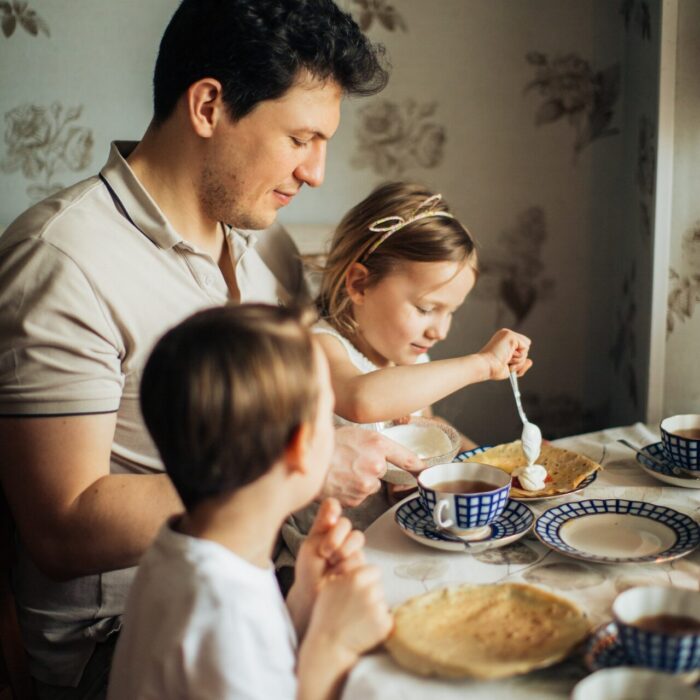 Family Sitting at Table