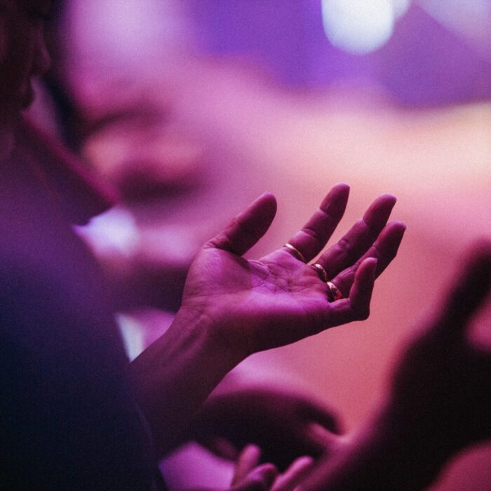 person raising his left hand