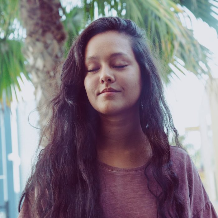 woman wearing heather-pink shirt