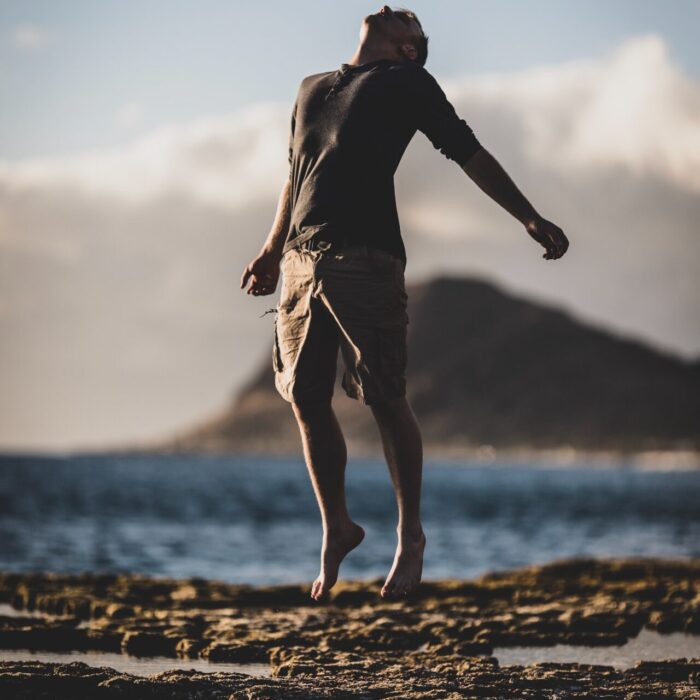 man standing near seashore