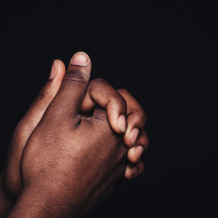 person holding babys hand