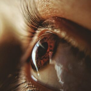 persons eye in close up photography