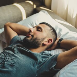 man lying on bed