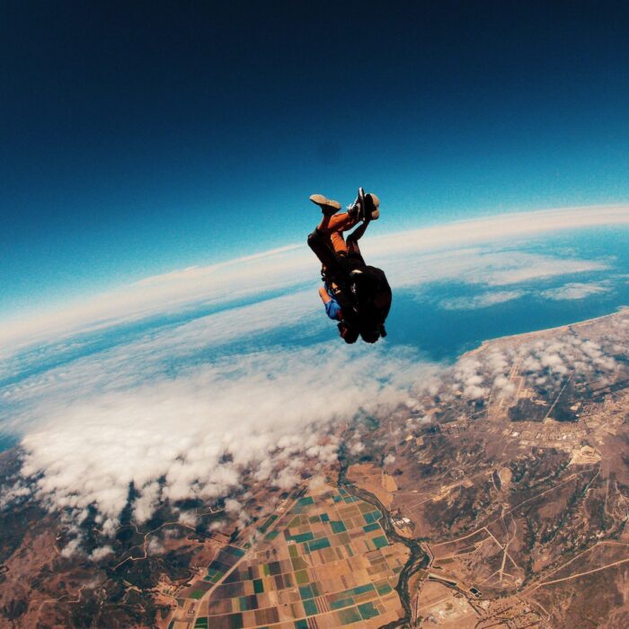 person skydiving on air during daytime