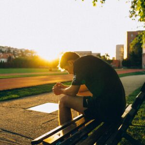 man sitting on bench