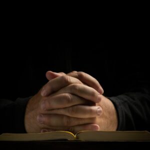 a person's hands on a book