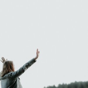 woman raising her hands